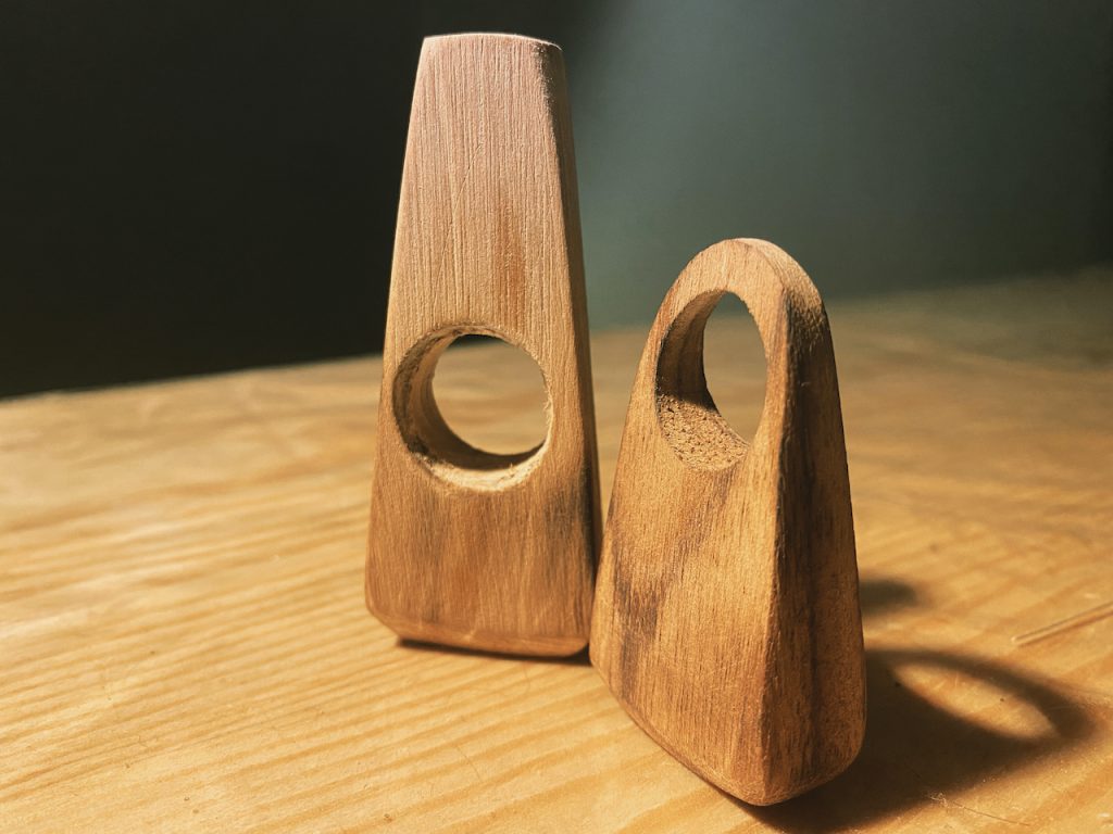 These wooden figurines, with its unique central hollow, symbolizes a serene balance and inner peace, promoting a sense of well-being and mindfulness in your space.